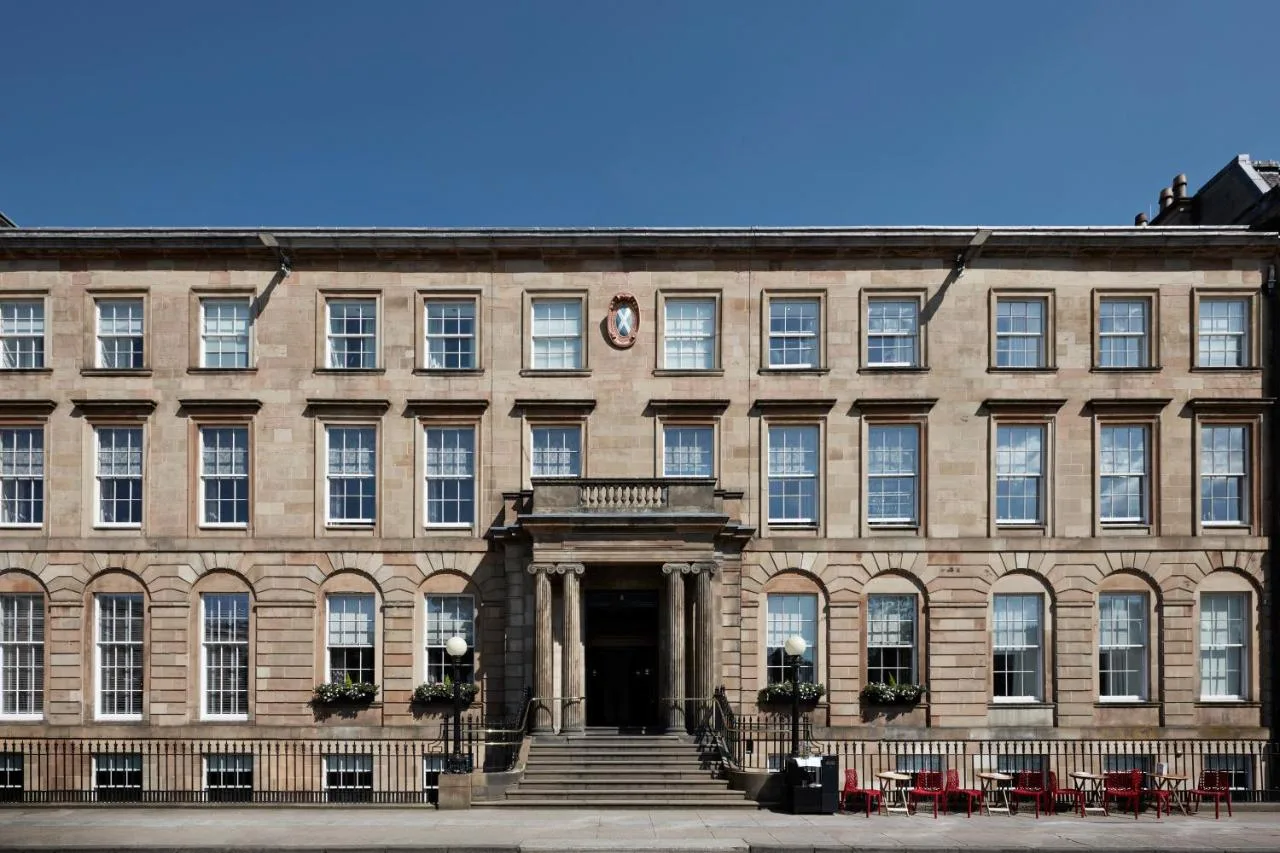 a large brick building with a staircase in front of it at Kimpton Blythswood Square Hotel & Spa by IHG in Glasgow